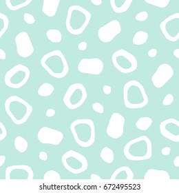 Spotted abstract seamless vector pattern with free hand drawn spots, specks, flecks, mots, stains of different size and shape. Polygonal uneven pieces texture. Cute natural forms background.