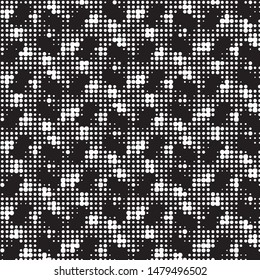 Spotted black and white grunge vector line background. Abstract halftone illustration background. Grunge grid polka dot background pattern