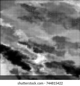 Spotted black and white grunge vector line background. Abstract halftone illustration background. Grunge grid polka dot background pattern