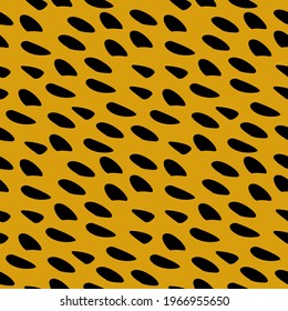 Spotted fur. Seamless yellow stained ornament.