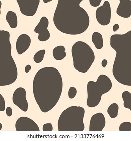 Spotted seamless pattern with beige background. White black cowboy digital paper with cow spots,  vector childish background for fabric, textile.