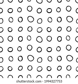 Spotty abstract vector seamless pattern. Random rings, dots, circles, spots, stains, bubbles, stones in row. Design for fabric, funny cute print. Repetitive graphic background and texture