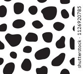 Spotty black and white seamless pattern. Cow's skin or dalmatian dog's skin pattern. Spots. Vector illustration.