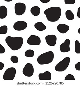 Spotty black and white seamless pattern. Cow's skin or dalmatian dog's skin pattern. Spots. Vector illustration.