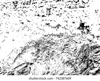 Spotty surface. White, black background.