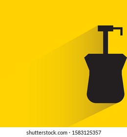 spray bottle with drop shadow in yellow background