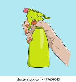 Spray bottle in a female hand, color image
