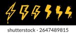 Spray orange graffiti element set of ENERGY Lightning bolt with grungy texture. Grunge ink graphic symbols of flash, danger, energy and thunder isolated on black background for printing on t shirt