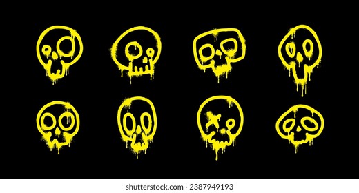 Spray paint. Abstract yellow skulls with paint drips on a black background. Skeleton head silhouette set in grunge style. Street art isolated elements. Graffiti or tattoo concept. Vector illustration.