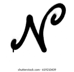 sprayed curly N font graffiti with leak in black over white