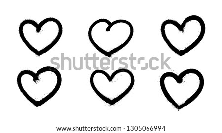 Sprayed graffiti hearts set in black on white. Vector illustration EPS 10