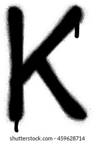 sprayed K font graffiti with leak in black over white