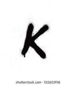 sprayed K font graffiti with leak in black over white