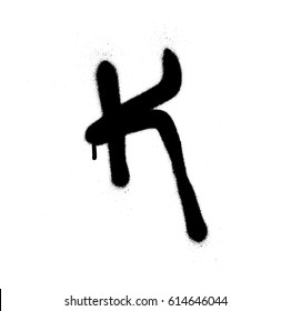 sprayed K font graffiti with leak in black over white