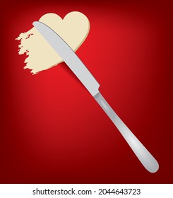 Spread butter with a table knife, butter in the shape of a heart.