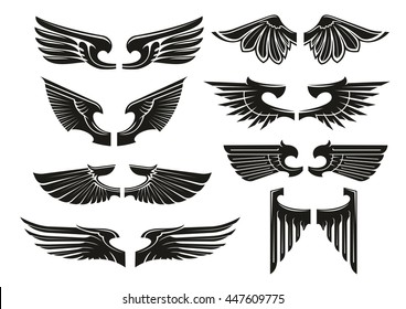 Spread wings design elements for medieval coats of arms, tattoo or jewelry with black silhouettes of paired heraldic wings