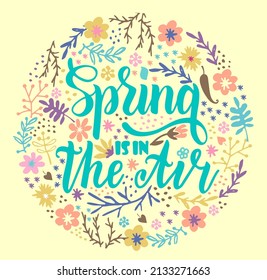 Spring is in the air. Badge typography element. Lettering spring season for greeting card, invitation template. Composition with spring flowers. Vector illustration. Hand lettered inspirational quote
