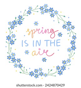 Spring is in the air. Floral round frame with many small blue flowers. Forget-me-not flowers. Cute spring wreath. Handwritten vector lettering.