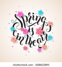 Spring is in the air stylish handwritten calligraphic phrase with colorful flowers and falling petals on beige background. Vecto rillustration