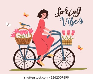 Spring bicycle trip. A woman rides a bicycle with flowers.