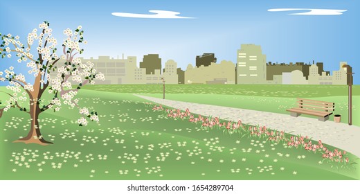 Spring in a big city in a Park. Beautiful Park in the spring, when flowers and Apple trees bloom.