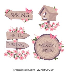 Spring blooming and wooden elements set. Cherry blossoms and a wooden birdhouse. A road sign with the greeting HELLO SPRING. Illustrated vector element collection.