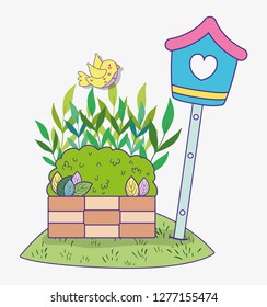spring bush with leaves and mailbox with bird
