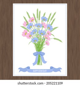 Spring card with abstract  flowers  and wheat ears on a wooden texture