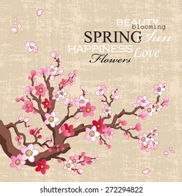 Spring card with blossoming sakura branch on a textural paper background