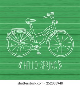 Spring card with hand drawn outline bicycle.