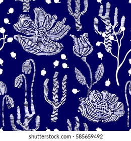 Spring colors. Floral seamless vector pattern with embroidery wildflowers and grass. Stylized hand drawn elements. 1950s-1960s motifs. Retro textile design collection. White on dark blue.