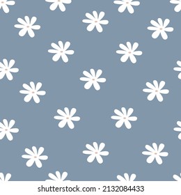 Flores lindas primaverales sin costura. Hermoso fondo floral. Impresión botánica simple vectorial. Resumen de margaritas blancas en un fondo azul.