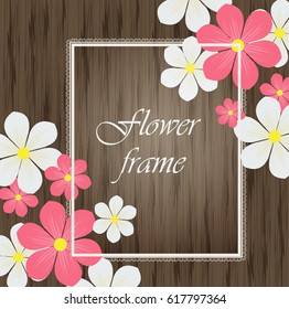 Spring daisy flowers on a wooden background. Frame for the inscription spring composition