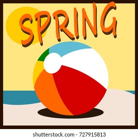 spring design with beach ball on sand