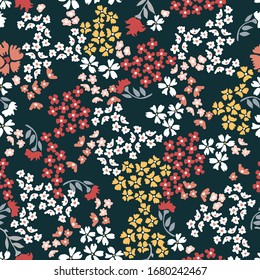 Spring ditsy pattern. Trendy fabric pattern with small flowers. Botanical seamless print with different floral elements. Vintage textile collection.