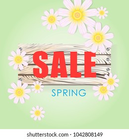 Spring expression with flowers on a wooden board