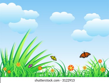 Spring field full of flowers and flying butterflies over cloudy blue sky