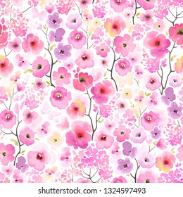 Spring floral seamless pattern of branches trees with colorful flowers in watercolor style. Vector abstract illustration.