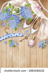 Spring floral top view background with lilac flowers in a ceramic vase, shoes, silk scarf, perfum on a wooden table