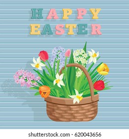 Spring flowers, bouquet in a basket and a sign with an inscription of a happy Easter. elements isolated on Blue wall board.