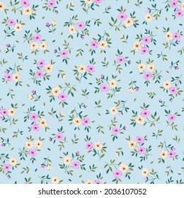 Spring flowers print. Vector seamless floral pattern. Plant design for fashion prints. Endless print made of small pastel color  flowers. Elegant template. Pale blue background. Stock vector.