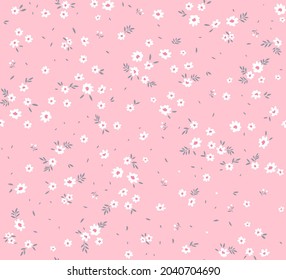 Spring flowers print. Vector seamless floral pattern. Floral design for fashion prints. Endless print made of small white flowers. Elegant template. Pale pink background. Stock vector.