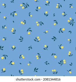 Spring flowers print. Vector seamless floral pattern. Floral design for fashion prints. Endless print made of small yellow flowers. Elegant template. Pale blue background. Stock vector.