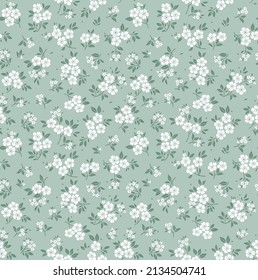 Spring flowers print. Vector seamless floral pattern. Floral design for fashion prints. Endless print made of small white flowers. Elegant template. Light Gray blue  background. Stock vector.