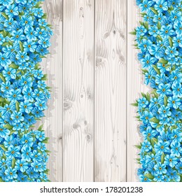 Spring forget-me-not on the background from white wooden boards