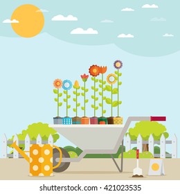 Spring Garden with Wheelbarrow, Watering Can and Flowers. Flat Design Style.