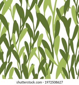 Spring greenery seamless pattern with green random leaf branches silhouettes. Isolated backdrop. Vector illustration for seasonal textile prints, fabric, banners, backdrops and wallpapers.