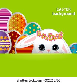 Spring greeting background with Easter eggs and a cute little white bunny. Festive paper images of decorated eggs and rabbit on a green background. Vector greetings card with the Happy Easter!