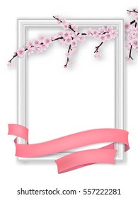 Spring greeting card with blooming sakura branch, photo frame and pink ribbon. Realistic vector template with blank space for text.