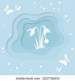 Spring greeting card in paper cut style with snowdrops and butterflies in blue and white on a layered background